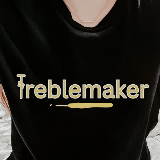 Person wearing a black t-shirt with 'freblemaker' printed in yellow.